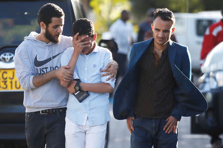 A relative reacts as he leaves the information centre following the Ethiopian Airlines Flight ET 302 plane crash, at the Jomo Kenyatta International Airport (JKIA) in Nairobi, Kenya March 10, 2019. REUTERS/Baz Ratner