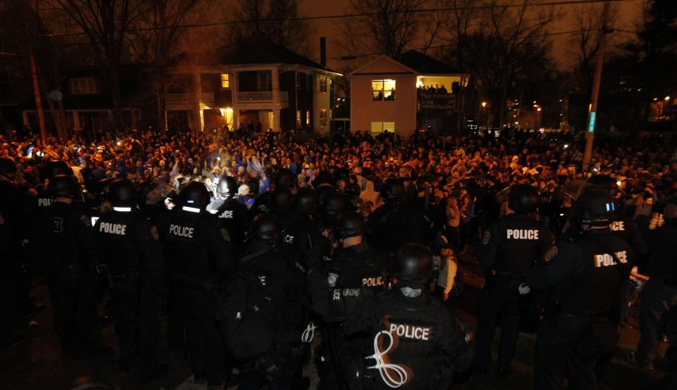 REFILE - CORRECTING SPELLING OF COUNTRY AFTER BYLINE University of Kentucky fans and students take to the streets after the University of Connecticut defeated Kentucky in the NCAA Men's National Basketball Championship, near the university campus in Lexington, Kentucky, April 7, 2014. Connecticut's experience trumped Kentucky's youth as the Huskies prevailed with a 60-54 NCAA national championship victory on Monday that completed a turnaround for the recently penalized program. REUTERS/ John Sommers II (UNITED STATES - Tags: SPORT BASKETBALL)