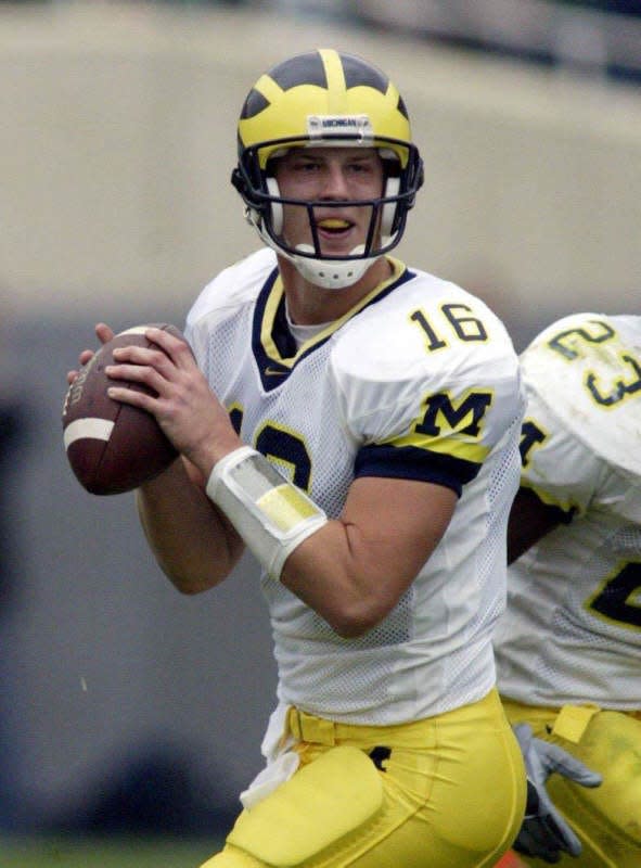 The Michigan Wolverines played  the Michigan State Spartans Saturday Nov. 1, 2003 at Spartan Stadium in East Lansing.  The Wolverines' John Navarre looks to pass against Michigan State during the second quarter.  Michigan went on to win the game 27-20 to make their record 8-2.