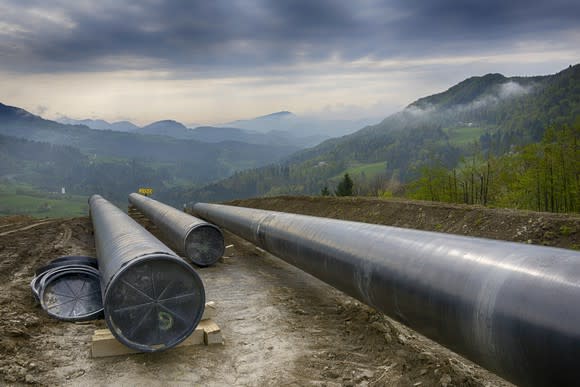 A pipeline under construction in the mountains.