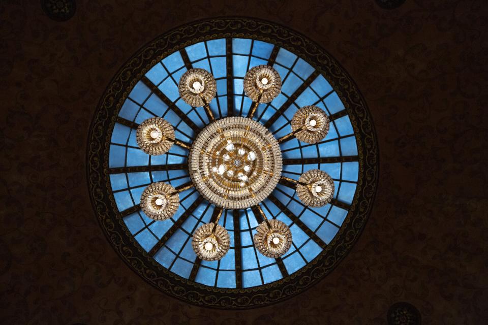 This photo taken on Thursday, Feb. 21, 2019, shows a chandelier and skylight inside one of halls of Moscow's iconic Metropol Hotel in Moscow, Russia. The Metropol, across the street from the Bolshoi Theater and 500 meters from Red Square, became a favorite with world leaders and celebrities. In 2009, U.S. President Barak Obama also gave a speech at the hotel. (AP Photo/Alexander Zemlianichenko)