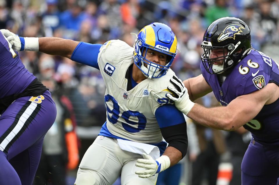 Los Angeles Rams defensive end Aaron Donald (99) rushes as guard Ben Cleveland (66) attempt to block at M&T Bank Stadium.