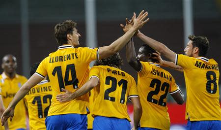 (L-R) Juventus' Fernando Llorente celebrates with his team mates Andrea Pirlo, Kwadwo Asamoah and Claudio Marchisio, after scoring a goal against Udinese during their Italian Serie A soccer match at the Friuli stadium in Udine April 14, 2014. REUTERS/Alessandro Garofalo