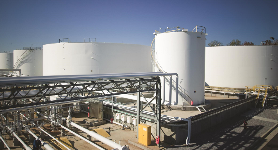 Oil storage tanks and pipelines at a network facility.