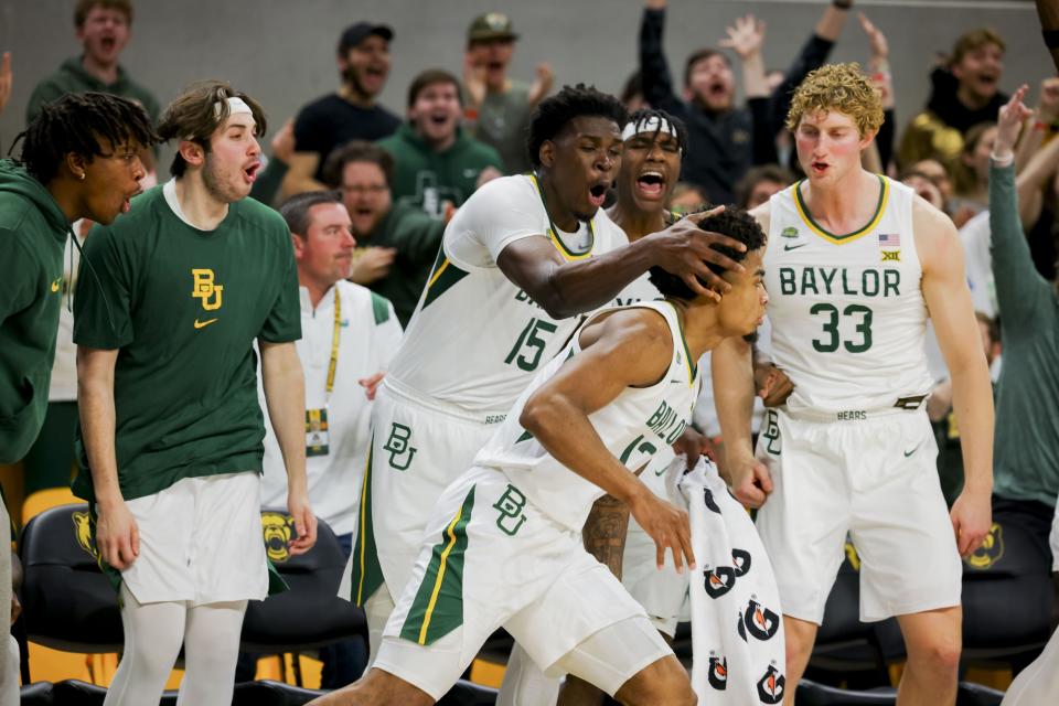 Baylor’s Josh Ojianwuna (15) and Caleb Lohner (33) celebrate with Langston Love, front, who scored against BYU on Tuesday, Jan. 9, 2024, in Waco, Texas. Baylor won 81-72. | Gareth Patterson, Associated Press