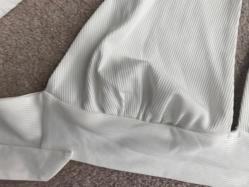 A piece of white fabric in a triangular shape