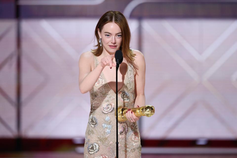 Emma Stone accepts the award for Best Performance by a Female Actor in a Motion Picture Musical or Comedy for "Poor Things" at the Golden Globes.