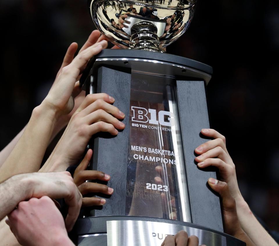 Purdue Boilermakers hold up the Big Ten Conference Champions trophy after the NCAA men’s basketball game against the Illinois Fighting Illini, Sunday, March 5, 2023, at Mackey Arena in West Lafayette, Ind. The Purdue Boilermakers won 76-71.