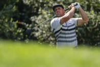 Bryson DeChambeau watches his tee shot on the 14th hole during the third round of the Wells Fargo Championship golf tournament at Quail Hollow, Saturday, May 8, 2021, in Charlotte, N.C. (AP Photo/Jacob Kupferman)