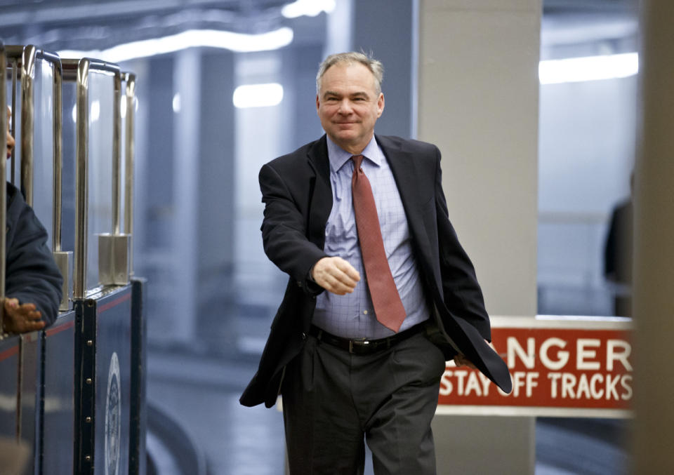 <p>Sen. Tim Kaine rushes to the Senate floor for a roll call vote as the Republican-controlled Senate moves ahead on a bill to construct the Keystone XL pipeline, Jan. 12, 2015. (Photo: J. Scott Applewhite/AP)</p>