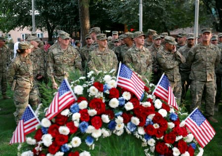 U.S. soldiers take part in a memorial ceremony to commemorate the16th anniversary of the 9/11 attacks, in Kabul