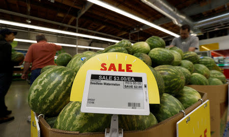 Watermelon prices are displayed on a digital price tag at a 365 by Whole Foods Market grocery store ahead of its opening day in Los Angeles, U.S., May 24, 2016. REUTERS/Mario Anzuoni