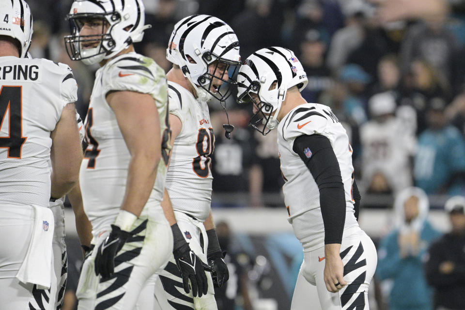 Cincinnati Bengals place-kicker Evan McPherson (2), right, celebrates after kicking the winning field goal in overtime at an NFL football game against the Jacksonville Jaguars, Monday, Dec. 4, 2023, in Jacksonville, Fla. The Bengals defeated the Jaguars 34-31. (AP Photo/Phelan M. Ebenhack)