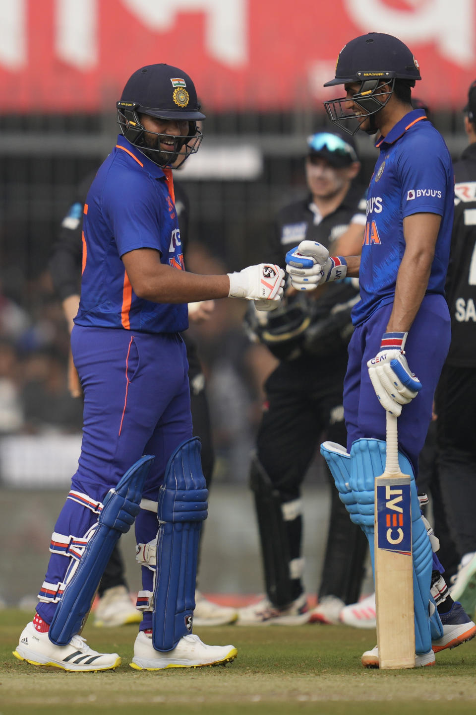 Shubman Gill, right, greets India's captain Rohit Sharma after scoring century during the third one-day international cricket match between India and New Zealand in Indore, India, Tuesday, Jan. 24, 2023. (AP Photo/Rajanish Kakade)