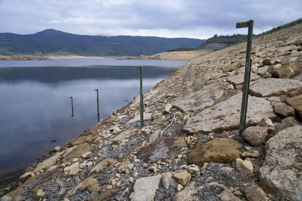 Water level markers stand in the San Rafael reservoir, a source of drinking water for Bogota that is low due to the El Niño weather phenomenon, in La Calera on the outskirts of Bogota, Colombia, Monday, April 8, 2024. Mayor Carlos Galan announced that water rationing measures for the capital will begin due to the low water level. (AP Photo/Fernando Vergara)
