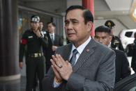 Thai Prime Minister Prayut Chan-O-Cha addresses reporters during a 2014 press conference in Bangkok