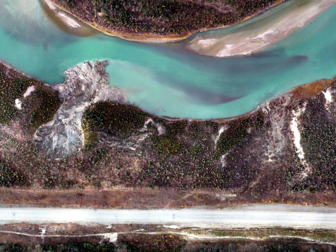 This aerial image shows the site of a permafrost slump that caused a landslide into the Yukon River near Whitehorse.  (Yukon University - image credit)