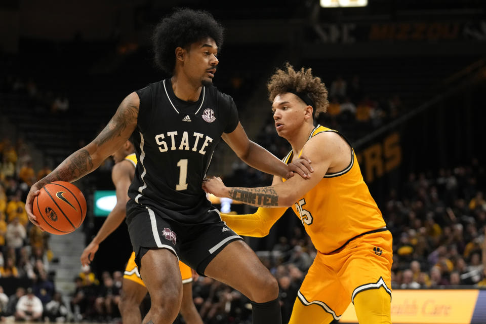 Mississippi State's Tolu Smith III (1) brings the ball down the court as Missouri's Noah Carter defends during the first half of an NCAA college basketball game Saturday, Feb. 10, 2024, in Columbia, Mo. (AP Photo/Jeff Roberson)