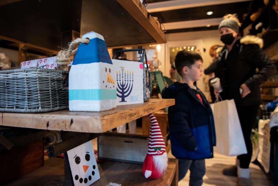 Lauren Rood, of Pipersville, shops at Makers off Main with her son, Beckett Rood, 3, on Small Business Saturday in Doylestown Borough on Saturday, November 27, 2021.