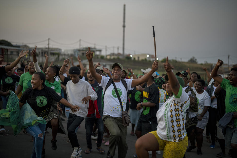 MK Party supporters dance in the middle of the street in Mahlbnathini village in rural KwaZulu-Natal, South Africa, on Thursday May 30, 2024. MK Party is currently leading in the provincial poll against the ANC, who've held the stronghold in the province for the last 20 years. (AP Photo/Emilio Morenatti)