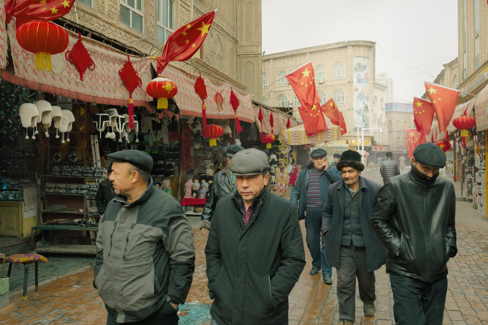 Uighur men strolling through Kashgar, Xinjiang, in January 2019<span class="copyright">Patrick Wack</span>