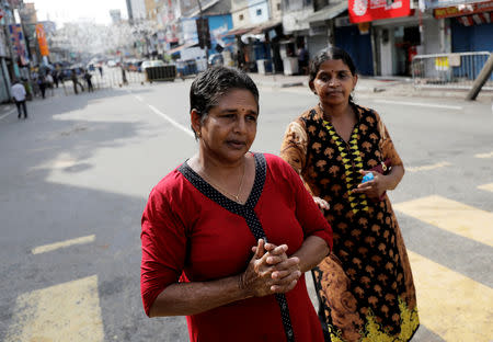 Sri Lankan Catholics pray on the road in front of St. Anthony's Shrine, where an explosion took place during mass on Easter Sunday, in Colombo, Sri Lanka May 5, 2019. REUTERS/Dinuka Liyanawatte