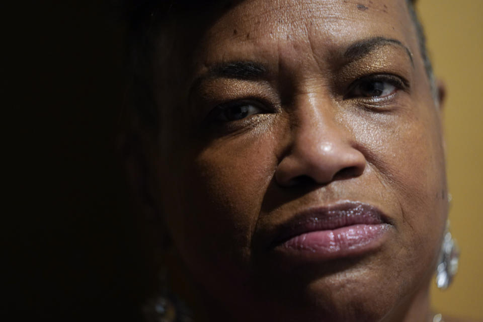 Karla Jefferies is shown in her kitchen in Detroit, Friday, March 5, 2021. As an African-American woman with diabetes and high blood pressure, she was at high risk for a bad outcome from COVID-19 and knows she’s lucky her initial illness wasn’t more serious. But her persistent symptoms and home confinement got her down and depression set in. (AP Photo/Paul Sancya)