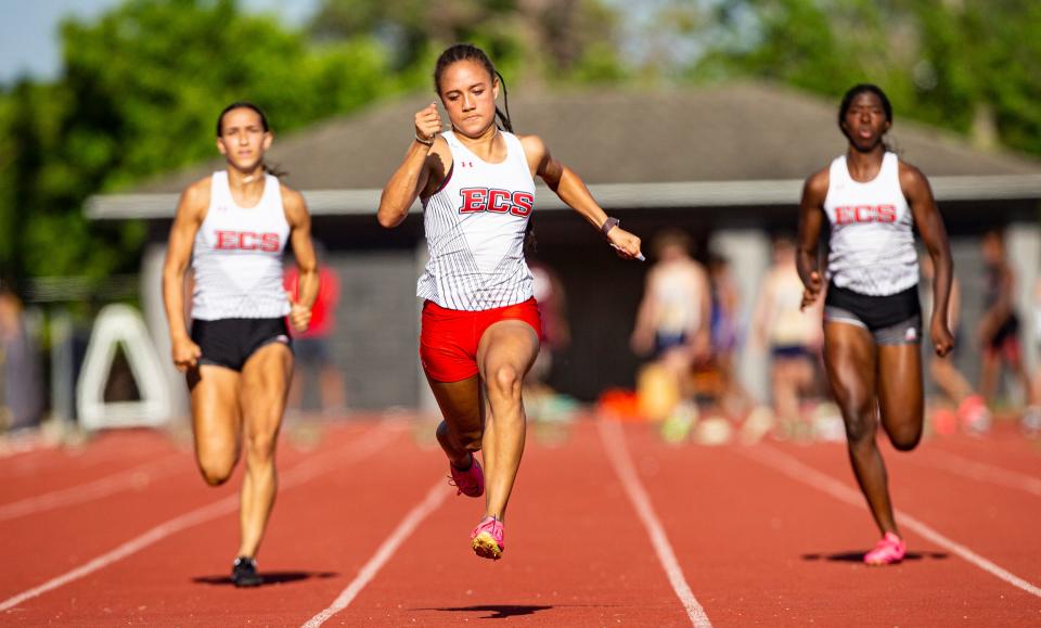 McKenzie Travis from Evangelical Christian School  wins the 100 meters at the Class 1A-District 12 track meet at ECS.  