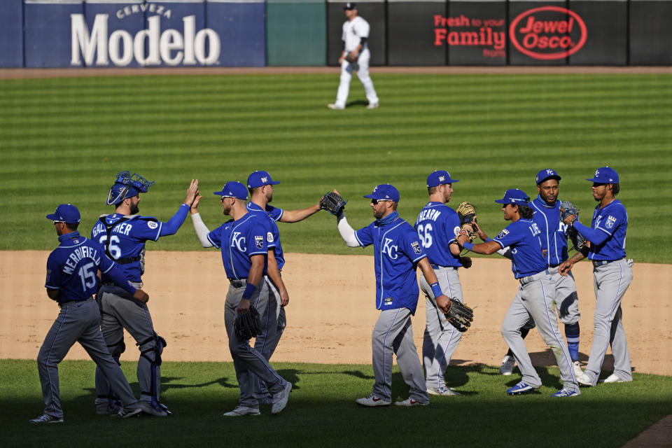 Kansas City Royals players celebrate after they defeated the Chicago White Sox 9-6 in a baseball game in Chicago, Saturday, Aug. 29, 2020. (AP Photo/Nam Y. Huh)