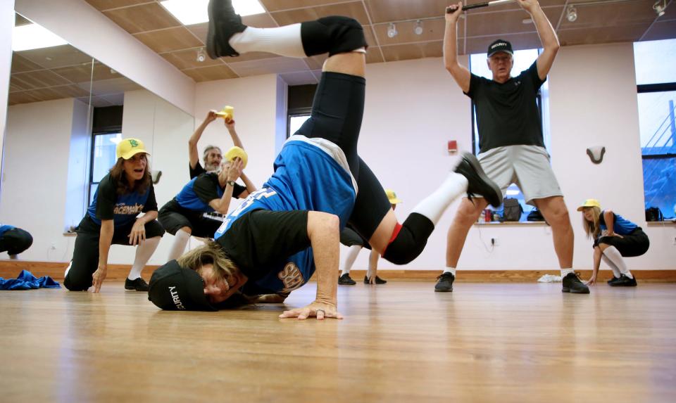 Dancers doing headspin