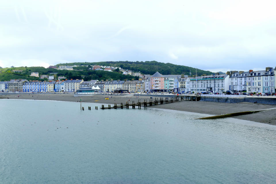 Aberystwyth, Wales, UK. July 22, 2016.  The North beach and marine terrace taken from the Royal Pier at Aberystwyth in Wales.