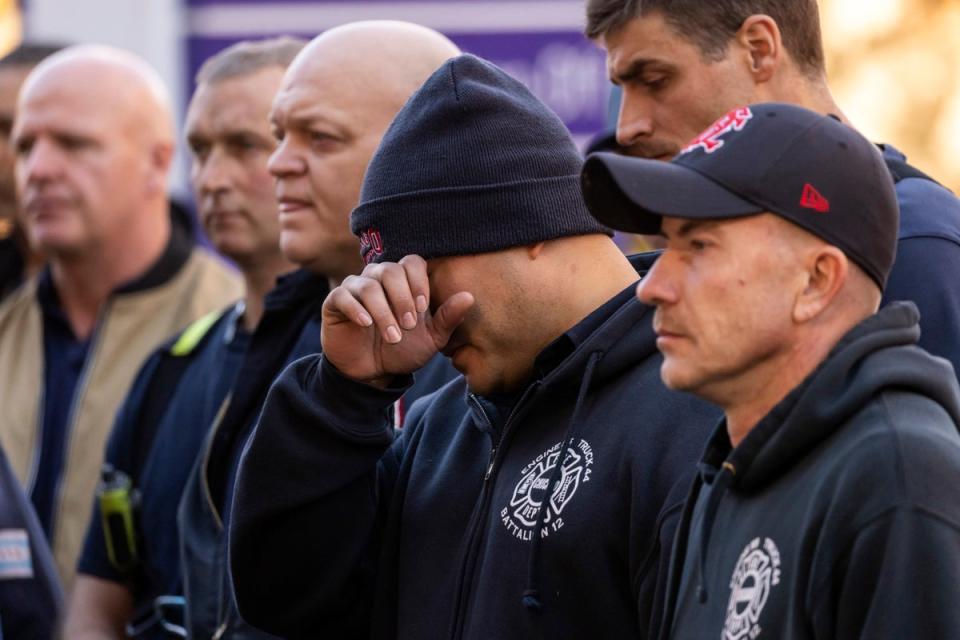 Chicago Fire Department personnel mourn outside Advocate Illinois Masonic Medical Center (AP)