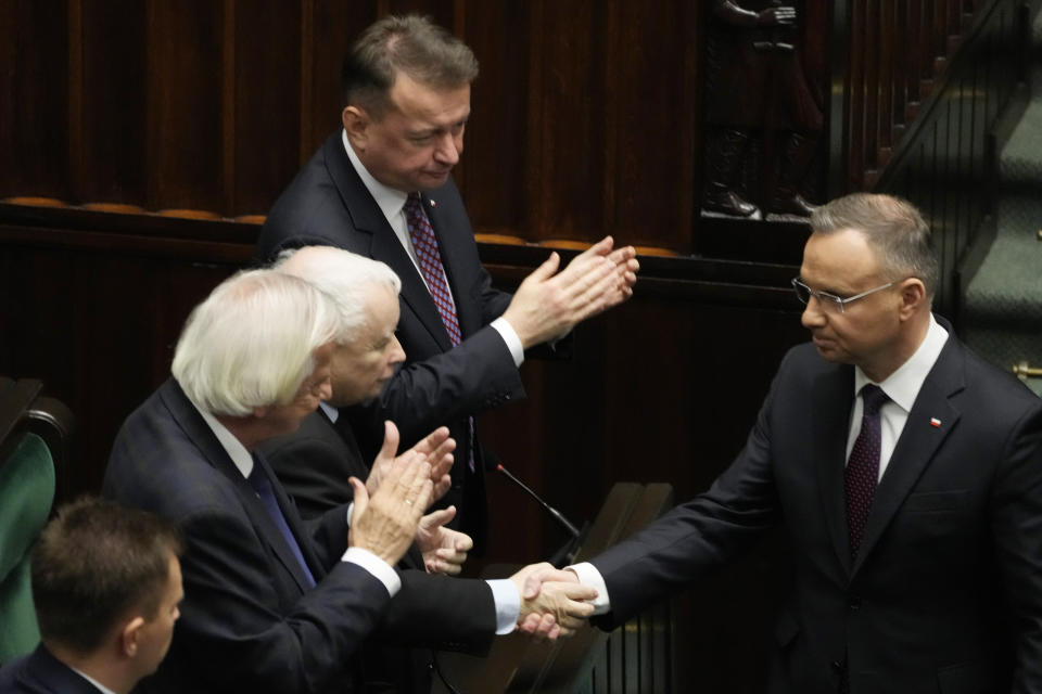 Poland's President Andrzej Duda, right, attends the first session of the lower house, or Sejm, of the newly-elected parliament in Warsaw, Poland, Monday Nov. 13, 2023. The Polish parliament gathered for the first time Monday after an election last month heralded a change of course for the Central European nation at a time of war across the border in Ukraine. (AP Photo/Czarek Sokolowski)