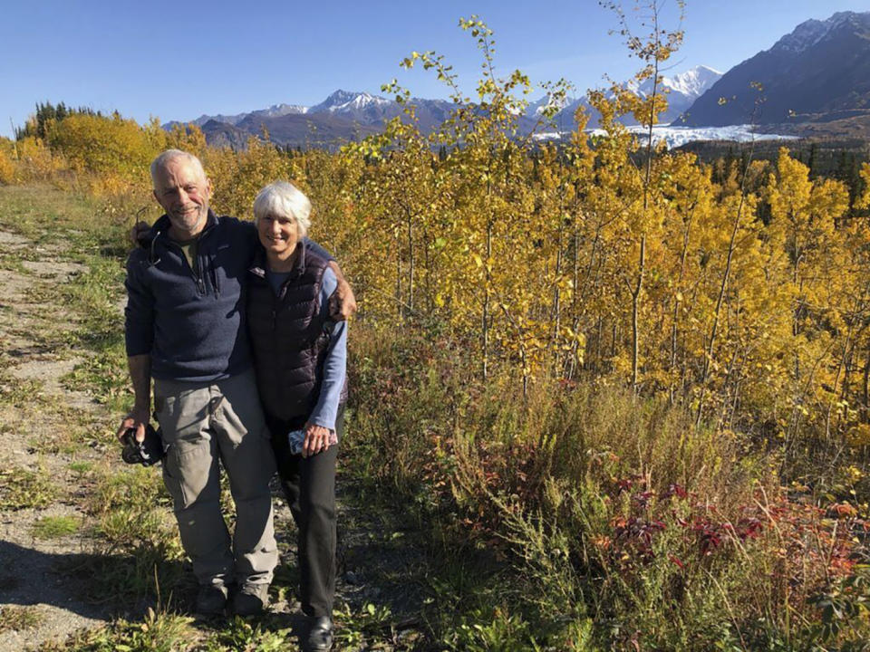 This 2021 photo provided by Gerri Martin shows Dale and Dianne Chorman with the Matanuska Glacier behind them, near Palmer, Alaska. Dale Chorman was attempting to photograph a moose and her newborn twins when the moose killed Chorman Sunday, May 19, 2024, in Homer, Alaska. (Gerri Martin via AP)