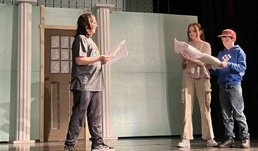 Monroe School of the Performing Arts students rehearse for “Fractured Fairy Tales.” Pictured are (from left) Bryson Goda, Londyn Heinzerling and Chance Wood.