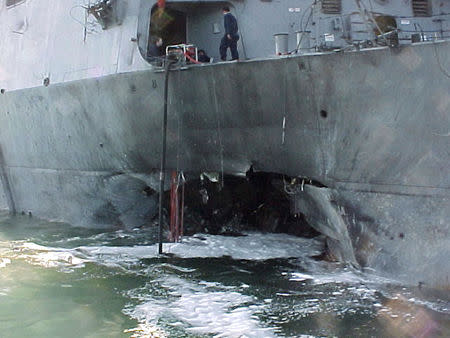 The port side damage to the guided missile destroyer USS Cole is pictured after a bomb attack during a refueling operation in the port of Aden in this October 12, 2000 file photo. REUTERS/Aladin Abdel Naby/Files (YEMEN)