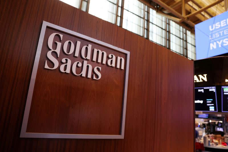 FILE PHOTO: FILE PHOTO: The logo for Goldman Sachs is seen on the trading floor at the New York Stock Exchange (NYSE) in New York City