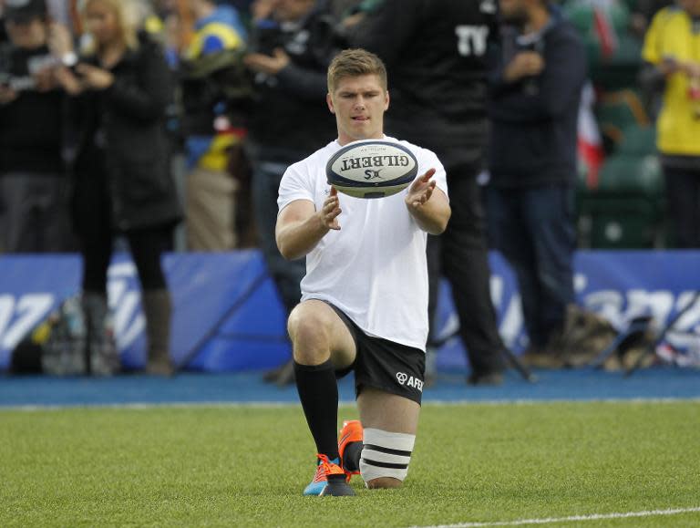 Saracens' fly-half from England Owen Farrell warms-up ahead of a rugby match in north London, on October 18, 2014