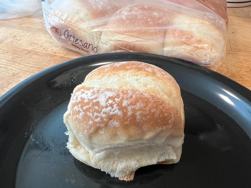 artesano bakery roll on a black plate