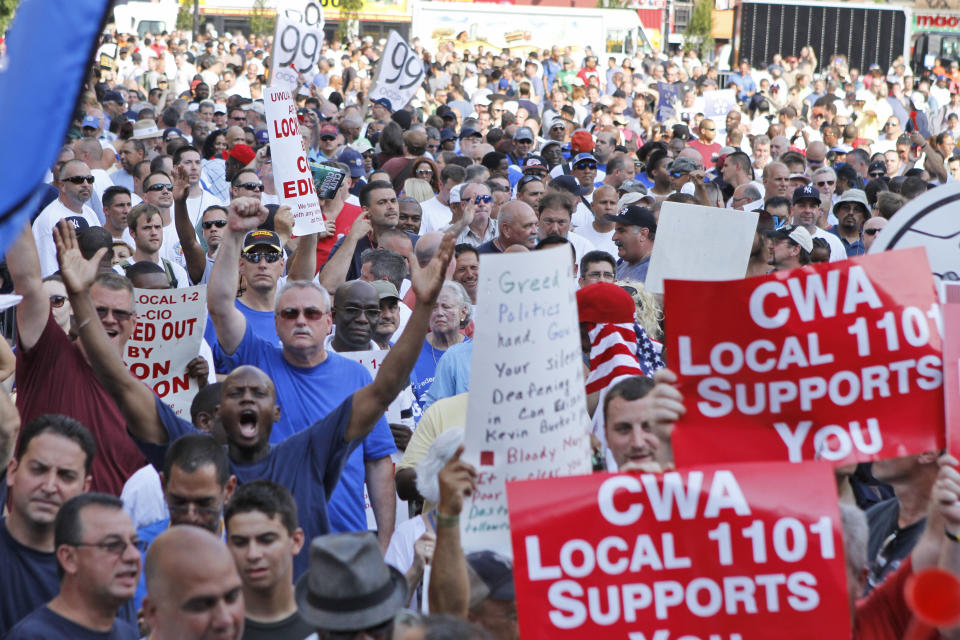 Members of the Utility Workers Union of America Local 1-2 rally during a march and rally at Union Square, Tuesday, July 17, 2012 in New York. Consolidated Edison workers were locked out on June 30 after their contract expired and negotiations over a new one failed. About 5,000 managers are keeping electricity going for 3.2 million customers in New York City and Westchester County. (AP Photo/Fay Abuelgasim)