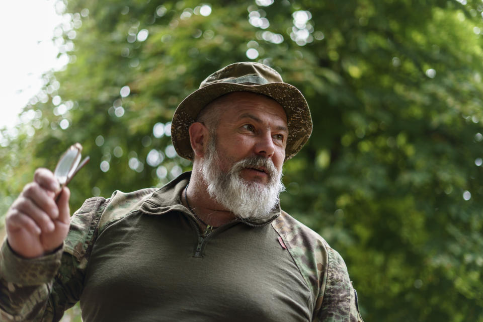 Col. Yurii Bereza with the Dnipro-1 regiment is photographed at the unit's headquarters during a period of relative calm near Sloviansk, Donetsk region, eastern Ukraine, Friday, Aug. 5, 2022. "I think it won't be calm for long. Eventually there will be an assault," Col. Bereza told the Associated Press on Friday, adding that he expected the area to get "hot" in the coming days. (AP Photo/David Goldman)