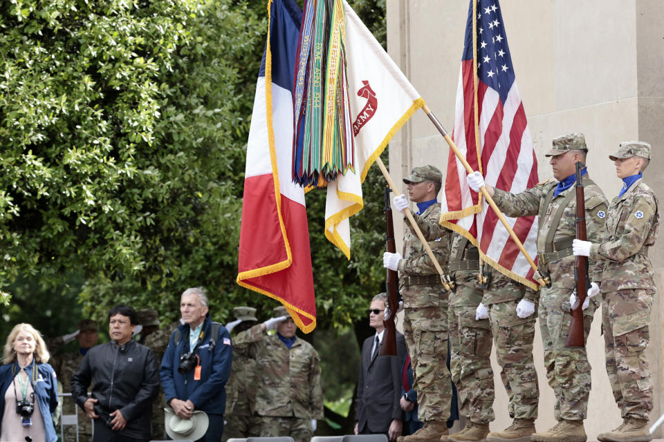 U.S. soldiers hold French and U.S. flags during the 78th anniversary of D-Day ceremony, in the Normandy American Cemetery and Memorial of Colleville-sur-Mer, Monday, June, 6, 2022. The ceremonies pay tribute to the nearly 160,000 troops from Britain, the U.S., Canada and elsewhere who landed on French beaches on June 6, 1944, to restore freedom to Europe after Nazi occupation. (AP Photo/ Jeremias Gonzalez)