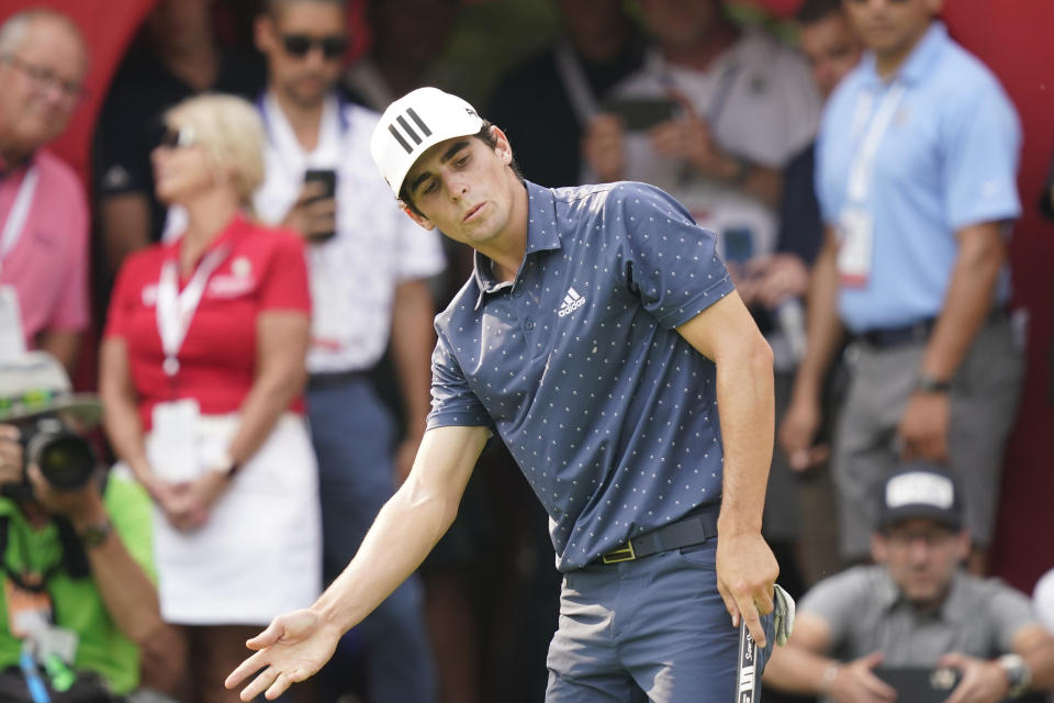 Joaquin Niemann of Chile reacts after missing a putt on the 18th green during the final round of the Rocket Mortgage Classic golf tournament, Sunday, July 4, 2021, at the Detroit Golf Club in Detroit. (AP Photo/Carlos Osorio)