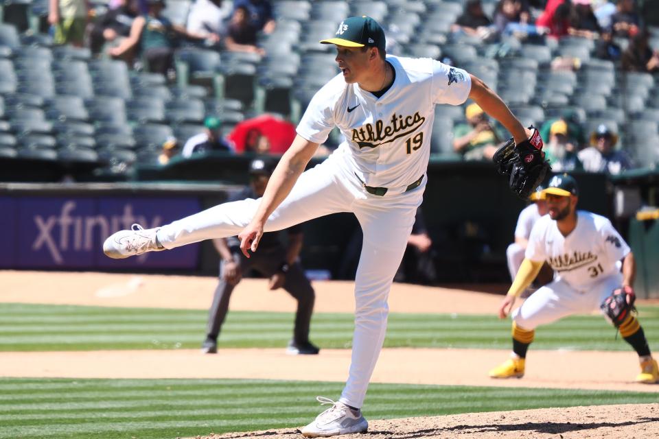 Oakland Athletics relief pitcher Mason Miller (19) pitches the ball against the Colorado Rockies during the tenth inning at Oakland-Alameda County Coliseum.