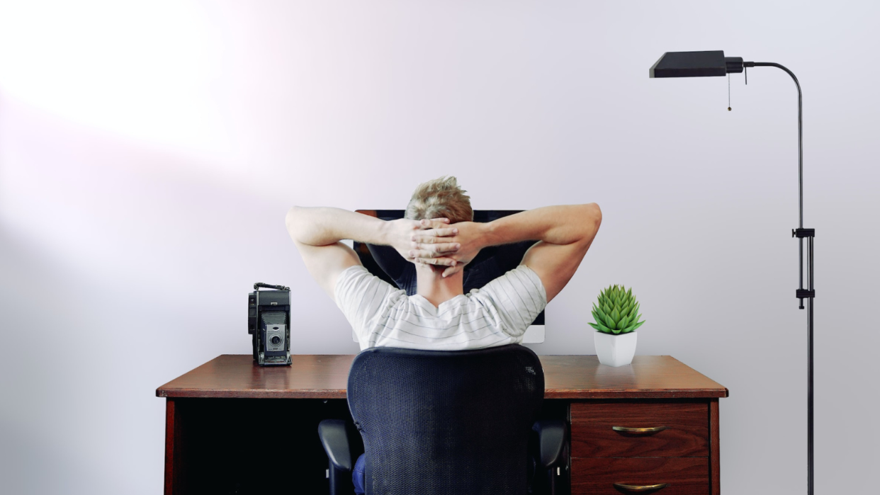  Remote worker relaxed in front of computer. 