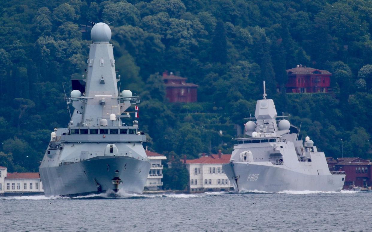 Royal Navy's Type 45 destroyer HMS Defender, followed by Royal Netherlands Navy frigate HNLMS Evertsen, sets sail in the Bosphorus, on its way to the Black Sea, in Istanbul, Turkey June 14, 2021 - reuters