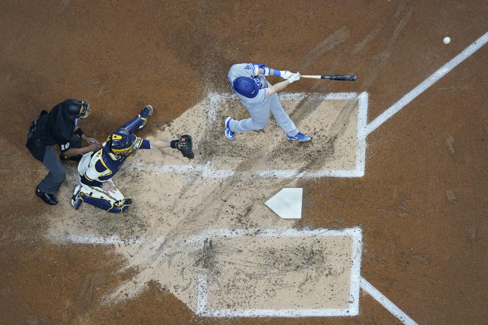 Los Angeles Dodgers' Will Smith hits a home run during the third inning of a baseball game against the Milwaukee Brewers Tuesday, May 9, 2023, in Milwaukee. (AP Photo/Morry Gash)