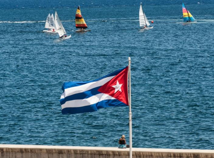 A Cuban national flag flutters as participants of the Havana Challenge regatta compete in Havana on May 19, 2015 (AFP Photo/Yamil Lage)
