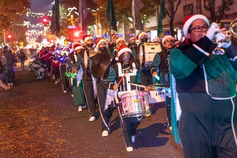 Dinuba High School Marching Band won "Best Band" for their entry in the Annual Candy Cane Lane Parade in Downtown Visalia on Monday, November 29, 2021.