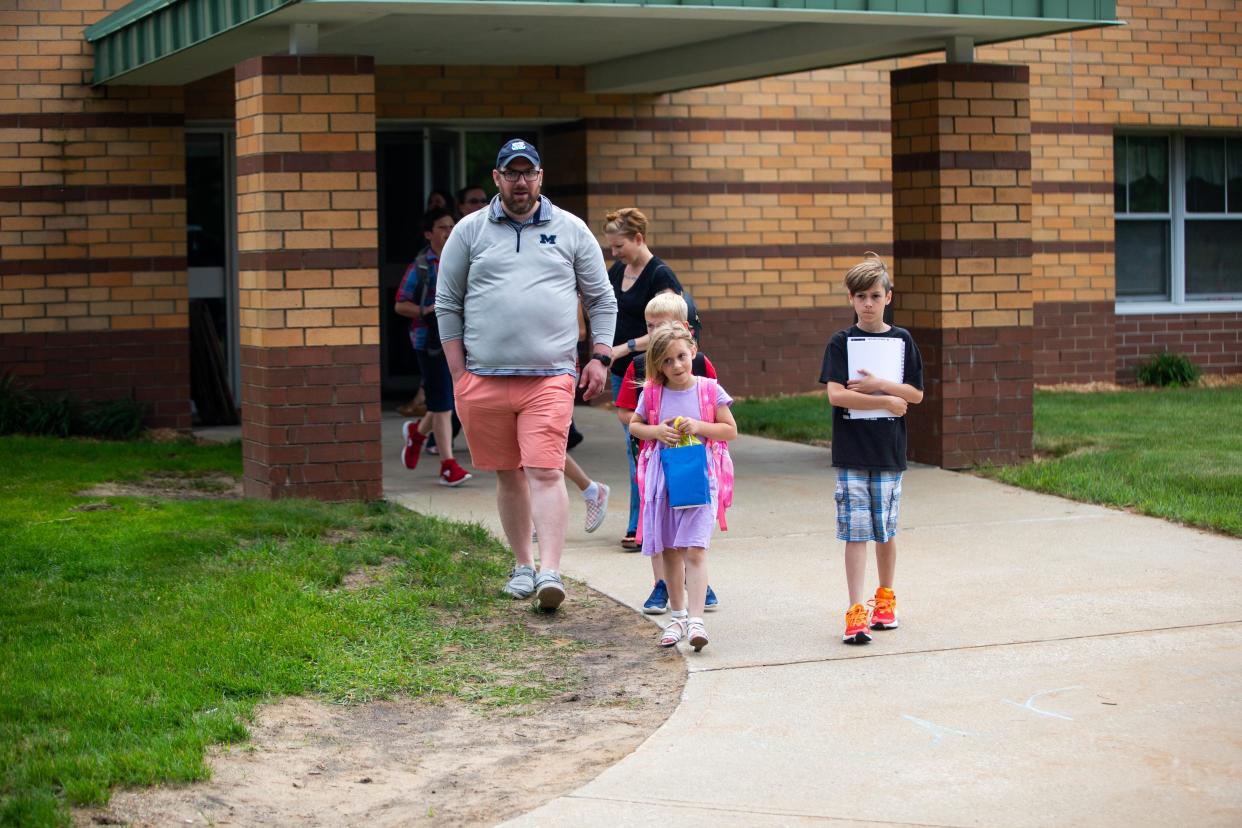 Families pick up their children on their student's last day of school Friday, June 10, 2022, at Great Lakes Elementary in Holland. In the latest edition of the Kids County report, Michigan ranks 32nd overall in childhood well-being.